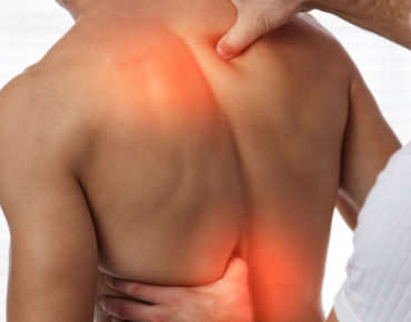 Physiotherapist treating back pain with manual therapy techniques