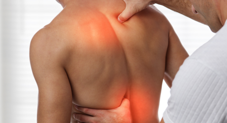 Physiotherapist treating back pain with manual therapy techniques