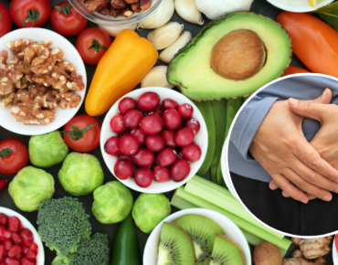 A variety of healthy, nutrient-rich foods such as fruits, vegetables, nuts, and seeds alongside an image of a person holding their abdomen, symbolizing the role of diet in navel displacement recovery.