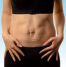 A person showing their abdominal area with visible signs of muscle weakness or misalignment, possibly related to navel displacement. The image highlights the impact of abdominal strain on core stability and posture.