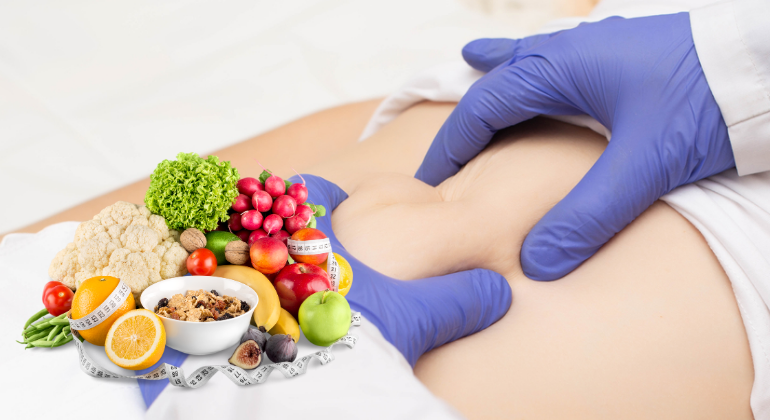 A practitioner performing an abdominal massage to address navel displacement, combined with healthy foods like fruits, vegetables, and grains that aid in recovery.